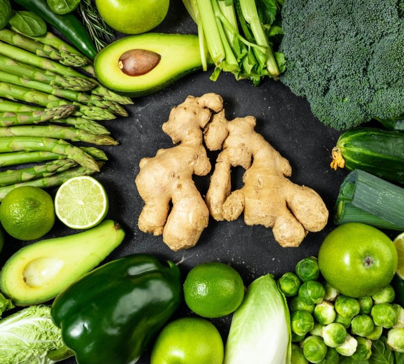 healthy-food-clean-eating-green-vegetables-fruits-and-ginger-on-dark-stone-background-1.jpg